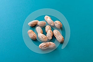 pile of peanuts on green background