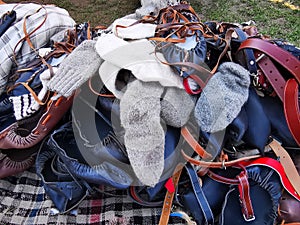 Pile of peasant sandals, wool socks and belts