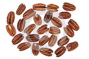 Pile Pecan nuts isolated on white background. Heap shelled Pecans nut close-up. Top view