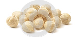 Pile of peeled roasted hazelnuts isolated on white background