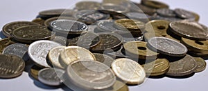 Pile of peseta coins with white background