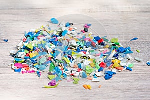 A Pile of PET bottle flakes, Plastic bottle crushed, Small pieces of cut colorful plastic bottles