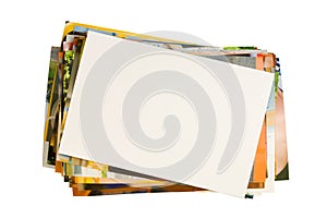 Pile of photographs with empty frame