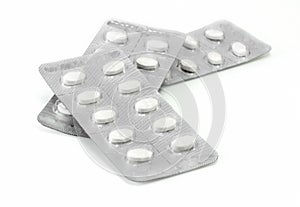 Pile of pills in blister packs photo
