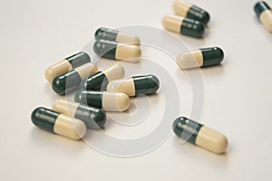 Pile of pills close up on white background