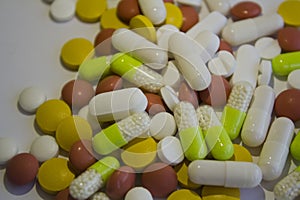 Pile of pills, tablets, capsules of different colors