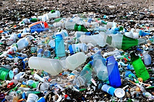 Pile of Plastic Bottles and Garbage Strewn along a Beach AI Generated photo