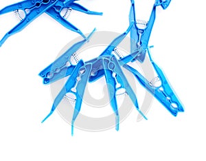 Pile of plastic cloth pegs isolated over white background