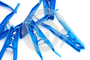 Pile of plastic cloth pegs isolated over white background