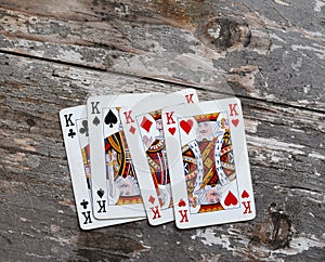 Pile of playing cards at a rustic wooden board. Playing cards on a rustic wooden table.