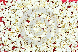 A pile popcorn on red background