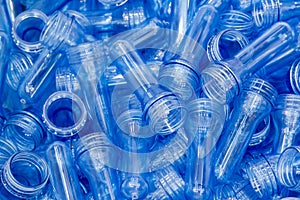 The pile of the preform shape of plastic bottle products.