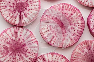 Pile of purple daikon radish slice isolated on white background