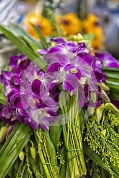 Pile of purple orchid flowers stacked