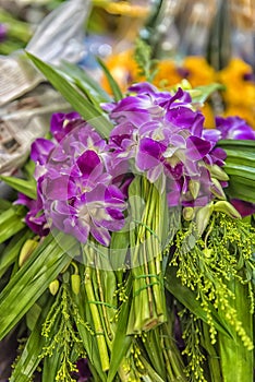 Pile of purple orchid flowers stacked