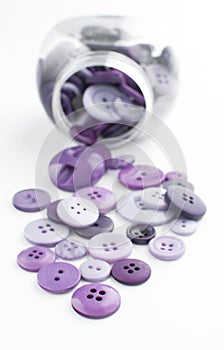 Pile of purple sewing buttons