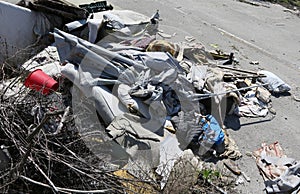 Pile of rags and garbage in a homeless camp after the forced evi