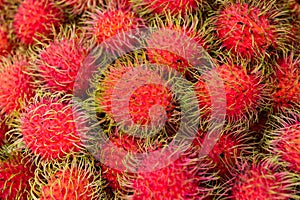 Pile of rambutan fruits on fresh market