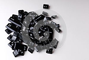 a pile of random computer keyboard keys on a white background