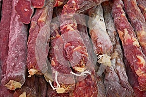 A pile of raw dried sausages