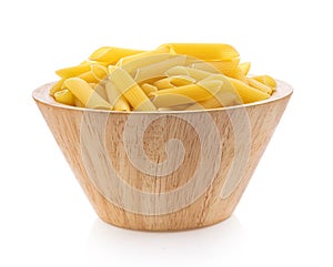 Pile of raw Macaroni Gomiti Pasta in wood bowl Isolated on white