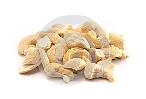 A Pile of Raw Natural Cashew Nut Pieces Isolated on a White Background