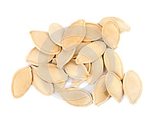 Pile of raw pumpkin seeds on white background