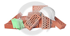 Pile of red bricks, hard hat and gloves on white background