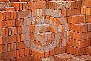 Pile of red bricks prepared for building