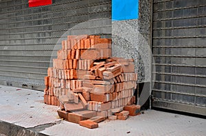 Pile of red bricks ready for construction