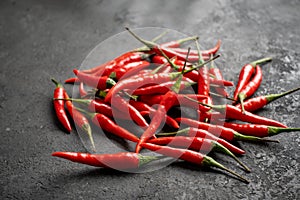 Pile of Red chili peppers on a black stone