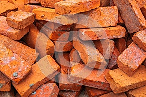 Pile of Red Clay Bricks on the Construction Work Site Floor