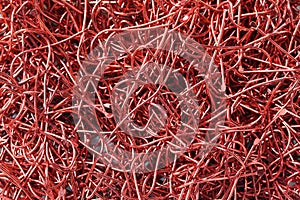 Pile of red Fish Hook.