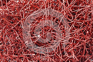 Pile of red Fish Hook.