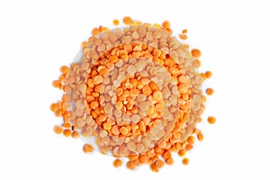 Pile of red lentils on white background.