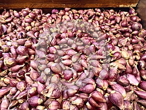 Pile of red onions in disp tgllay at the market