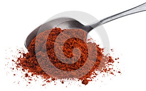 Pile of red paprika powder in spoon isolated on white background with clipping path