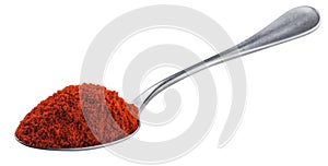 Pile of red paprika powder in spoon isolated on white background with clipping path, ground red pepper spice