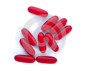 Pile of red pills isolated on white background, top view