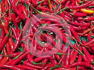 Pile of Red small Chili in the tray. Texture background of red pepper.