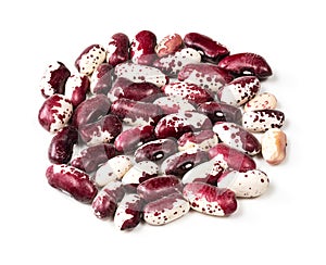 Pile of red speckled kidney beans closeup on white