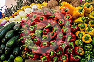 Pile of red and yellow peppers at the vegetables market.