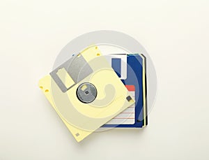 Pile of retro floppy disks. Diskettes isolated on white background