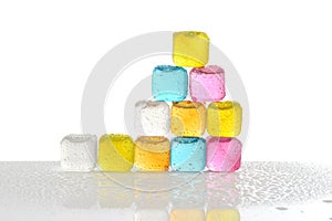 Pile of reusable colorful plastic ice cubes