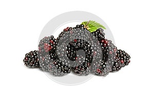 Pile of ripe blackberries and green leaf isolated on white