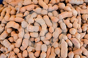 Pile of ripe Tamarind fruits.Sweet ripe tamarinds. Tamarind fruit Background. A big pile of tamarinds use for background or wallpa