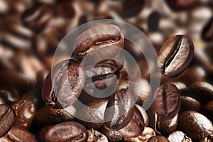 Pile of roasted coffee beans as background