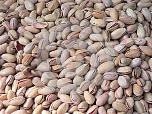 Pile of roasted and salted pistachios.
