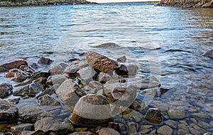 Pile of rocks in bay of lake Vattern Sweden