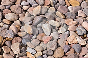 A pile of rocks with a variety of colors and sizes photo